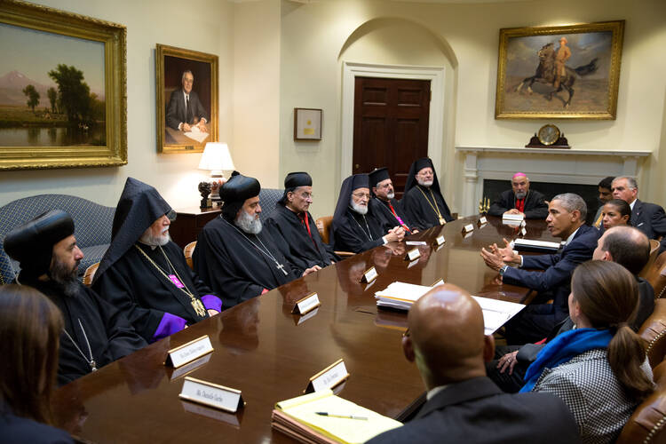 U.S. President Barack Obama gestures during a meeting with Lebanese Cardinal Bechara Rai, fourth from left, and other religious leaders at the White House Sept. 11. (CNS photo/Pete Souza, courtesy White House)