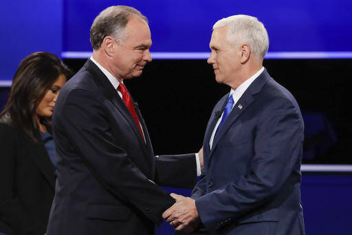 Republican vice-presidential nominee Gov. Mike Pence, right, and Democratic vice-presidential nominee Sen. Tim Kaine shake hands during the vice-presidential debate at Longwood University in Farmville, Va., Oct. 4 (AP Photo/David Goldman).