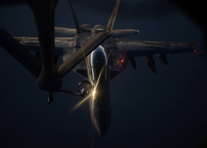 A U.S. Air Force fighter jet refueling over northern Iraq, Aug. 21 (courtesy U.S. Department of Defense).