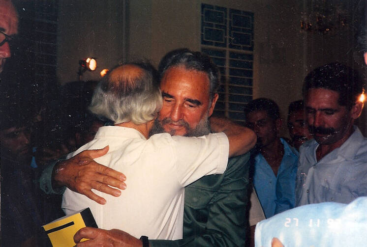 Fidel Castro embracing Paul Mayer with a Bible in his hand. Photos courtesy of wrestlingwithangelsbook.com.