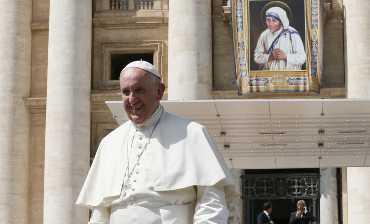 A tapestry of new St. Teresa of Kolkata is seen as Pope Francis leaves his general audience in St. Peter's Square at the Vatican Sept. 7. (CNS photo/Paul Haring)