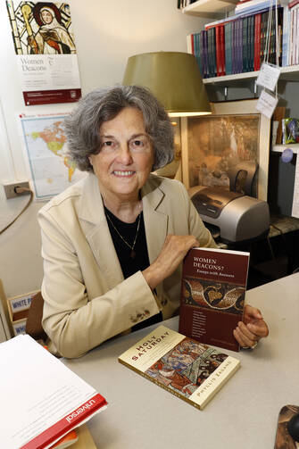 Phyllis Zagano, a senior research associate in the religion department at Hofstra University in Hempstead, N.Y., is seen in her office Aug. 2 (CNS photo/Gregory A. Shemitz).