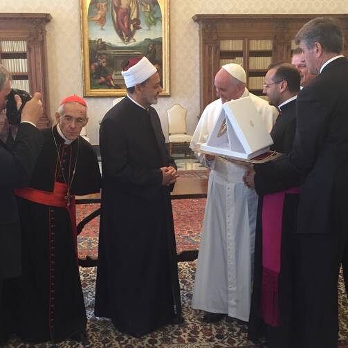 Pope Francis gives the sheik of Al-Azhar medallion of the Olive of Peace. 