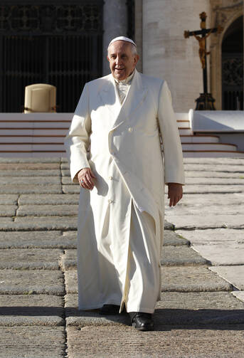 Pope Francis leaves general audience in St. Peter's Square, Dec. 10 (CNS photo/Paul Haring).
