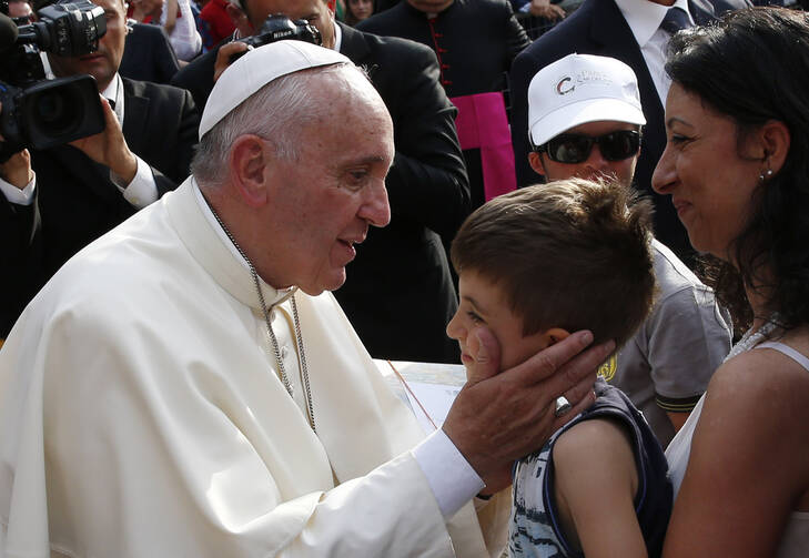 Pope Francis greets a boy during a gathering with young people in Turin, Italy, June 21 (CNS photo/Paul Haring).