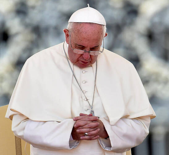 Pope Francis, seen praying during his weekly audience in St. Peter's Square at the Vatican Aug. 26, has issued a letter offering a series of instances in which absolution can be granted during the Year of Mercy. (CNS photo/Ettore Ferrari, EPA)