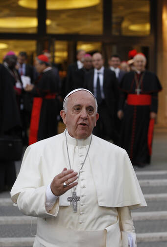 Pope Francis thanks the media as he leaves the concluding session of the extraordinary Synod of Bishops on the family at the Vatican Oct. 18. (CNS photo/Paul Haring) 