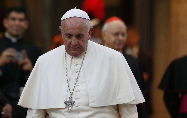 Pope Francis leaves the concluding session of the extraordinary Synod of Bishops on the family at the Vatican Oct. 18. (CNS photo/Paul Haring)