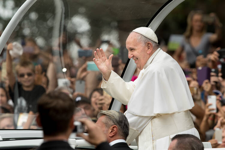 Pope Francis waves to the crowd as he arrives to celebrate the final Mass for the World Meeting of Families along Benjamin Franklin Parkway in Philadelphia Sept. 27. (CNS photo/Lisa Johnston, St. Louis Review) 