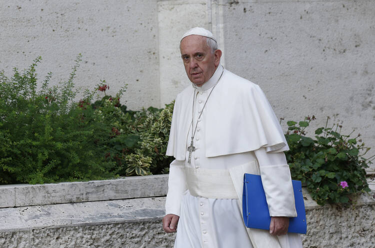 Pope Francis arrives for the morning session of the Synod of Bishops on the family at the Vatican, Oct. 6 (CNS photo/Paul Haring).