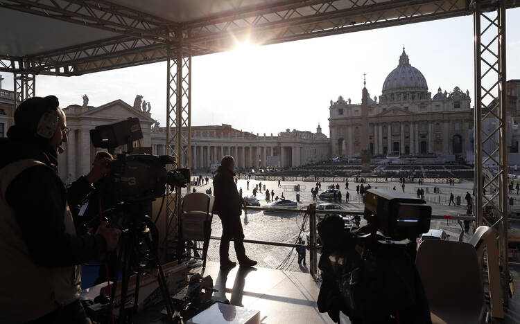 Technician works on a structure set up for TV media in St. Peter's Square at Vatican -- CNS photo/Alessandro Bianchi, Reuters