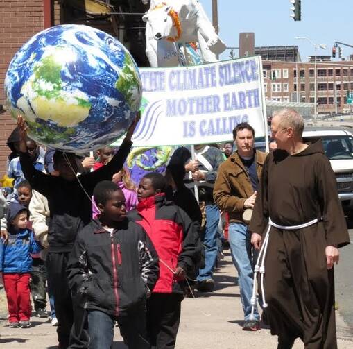 Sam Fuller, OFM Cap., leading a march on climate change in Hartford, Ct. (Photo via Wikimedia Commons)