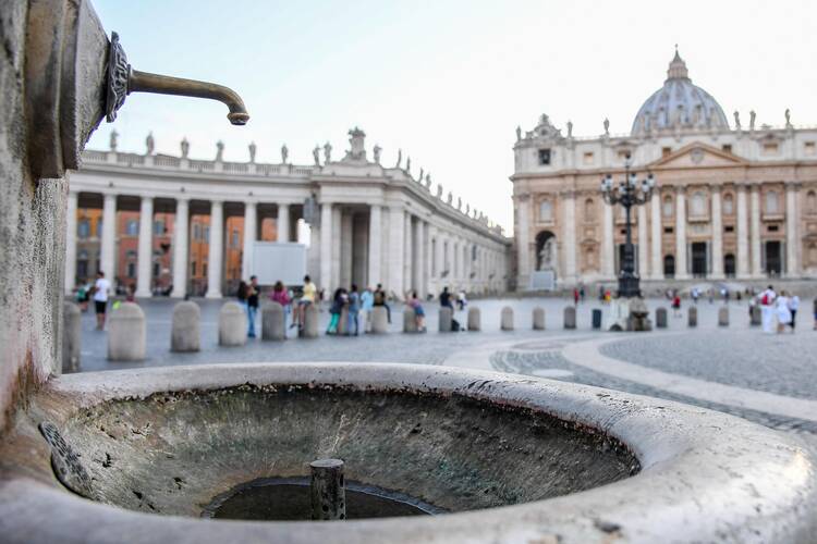 A dry fountains is seen in St. Peter's Square at the Vatican on July 24. The Vatican says it is shutting off all its fountains, including those in St. Peter's Square, because of Italy's drought. (Alessandro Di Meo/ANSA via AP)