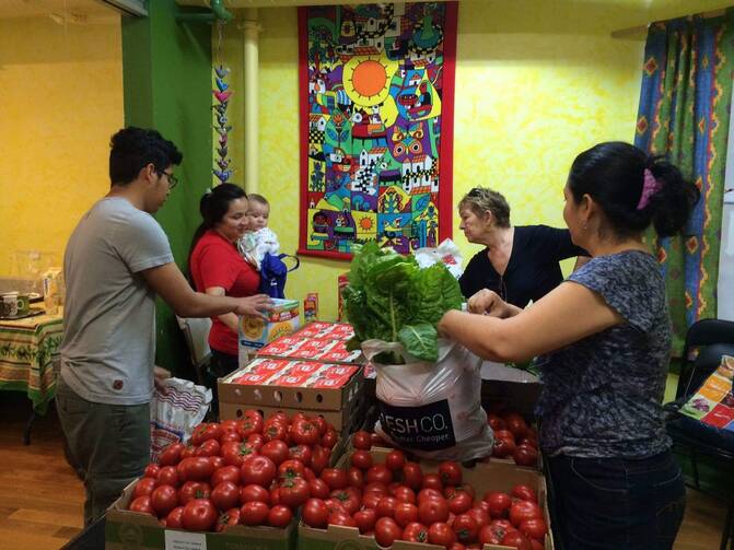 The weekly food basket distribution at Romero House