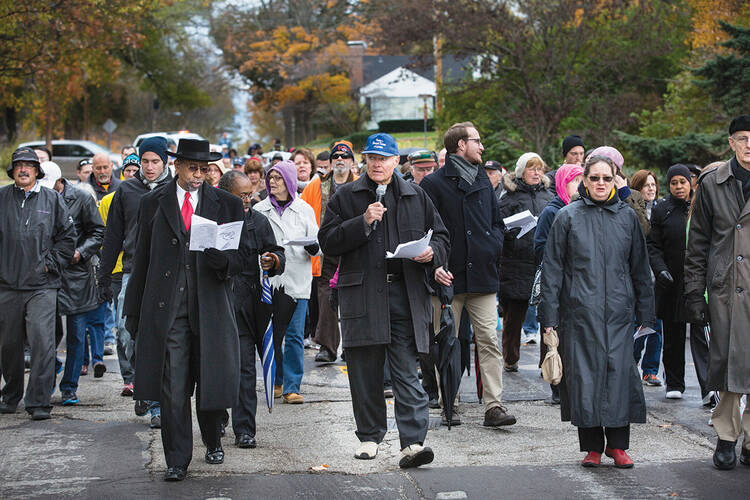 WALK BY FAITH. Parishioners from 10 churches in Ferguson, Mo., walk to City Hall on Nov. 2. 