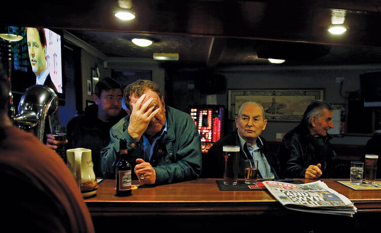 SCOTLAND THE BRAVE? Britain's Deputy Prime Minister Nick Clegg appears on a television screen in a pub in Kilmarnock, Scotland. 