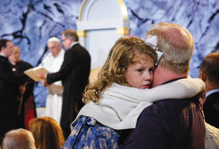 LOVE IN ACTION. A father holds his daughter at the Festival of Families with Pope Francis in Philadelphia on Sept. 26. 