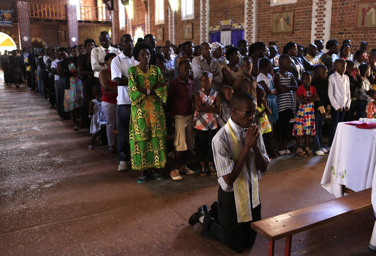 Remembering the victims during Mass at St. Famille Church in Kigali on April 6.