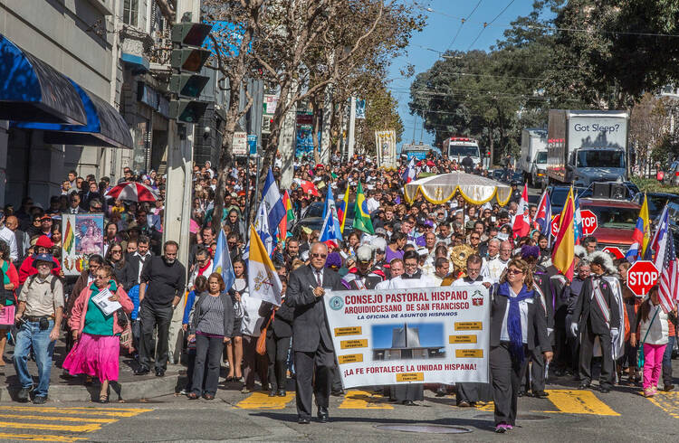 Large crowd processes through streets of San Francisco during annual rosary rally, Oct. 11, 2014.