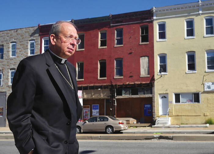 HOPE BUILDING. Archbishop William Lori tours West Baltimore the morning after civil unrest brought national attention to conditions in the city’s Sandtown neighborhood.