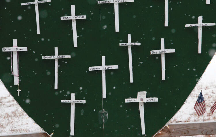 SNOWFLAKES: A winter scene over a memorial for the victims of the Sandy Hook Elementary School shooting in Newtown, Conn., on the first anniversary of the massacre there.