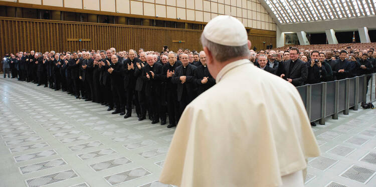 POPE-ULARITY CONTEST. Pope Francis is greeted with applause during a meeting in Paul VI Audience Hall at the Vatican on March 6.