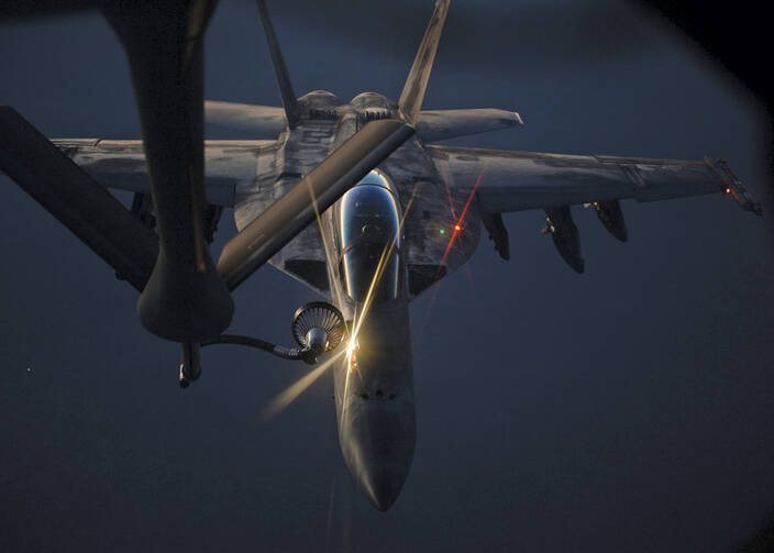 AIR BORNE. A U.S. fighter jet refueling over northern Iraq on Aug. 21. 