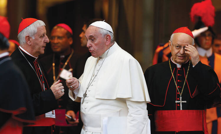 FINAL WORDS. Pope Francis talks with Italian Cardinal Giuseppe Versaldi as they leave the synod’s concluding session on Oct. 18. At right is Italian Cardinal Lorenzo Baldisseri, general secretary of the Synod of Bishops.