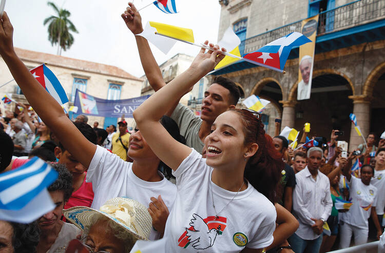 THE POPE’S CUBAN “DREAMERS.” Young people cheer as Pope Francis arrives at the cathedral in Havana, Sept. 20.