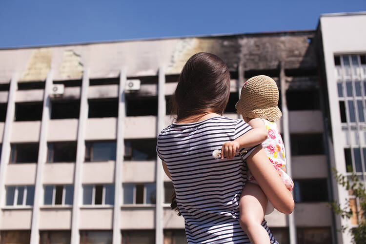 CITY IN RUINS. Reviewing Mariupol's burned out city hall. 