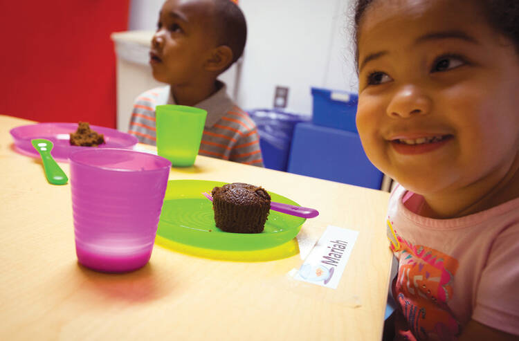 BUDGET PRIORITIES: Getting down to business at the Baltimore Catholic Charities Head Start program in Edgewood, Md., in June.