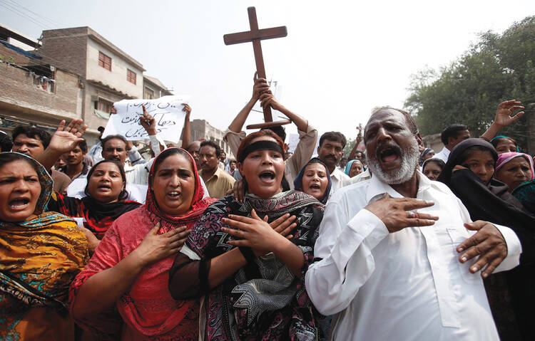 PERSECUTED COMMUNITY. Pakistani Christians at a protest rally in 2013 to condemn a suicide attack on All Saints Church in Peshawar.