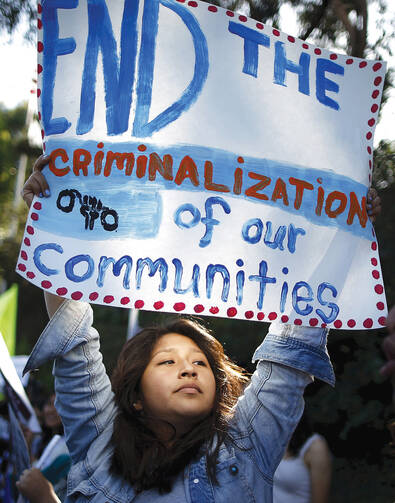 DETENTION PROTEST. An immigration advocate demonstrates in Los Angeles on July 10. 