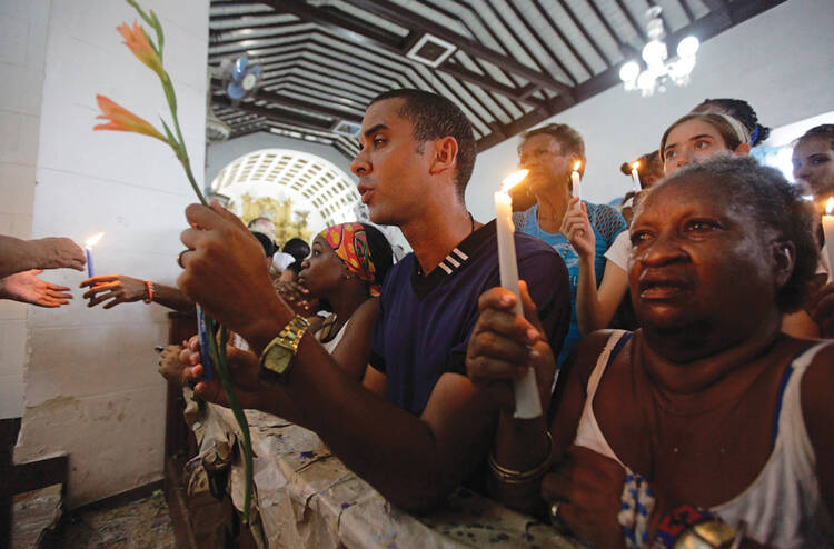 At prayer in Cuba