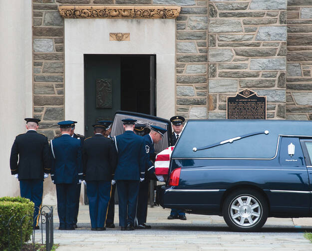 Soldiers carry the casket of Beau Biden.