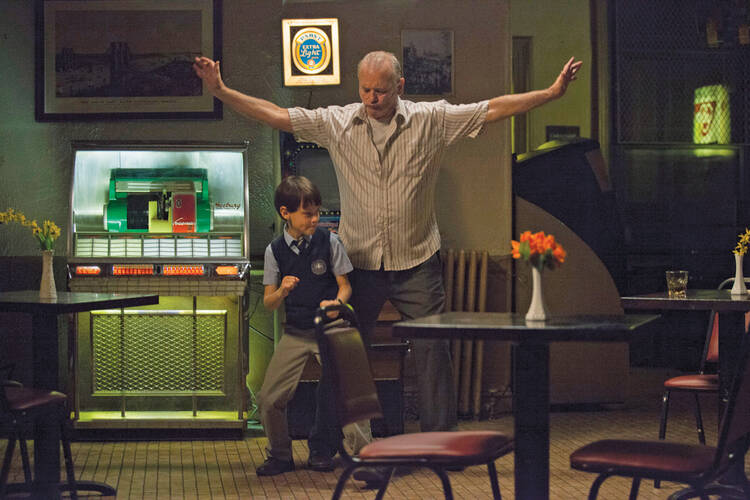 BAD BABYSITTER. Jaeden Lieberher and Bill Murray in “St. Vincent”