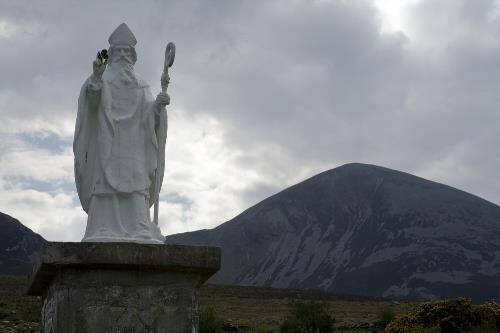 Statue of Saint Patrick at the base of Ireland's Holy Mountain named after him, Croagh Patrick, in County Mayo, the West of Ireland