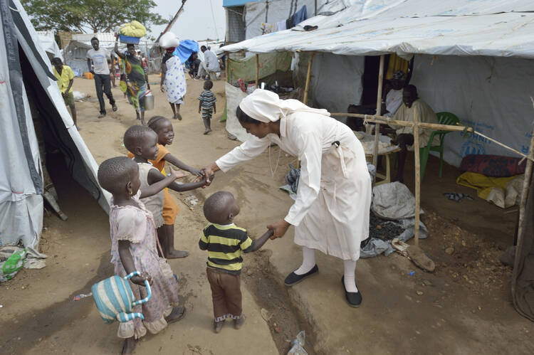 Sister Suja Francis, a member of the Daughters of Mary Immaculate, greets children inside a United Nations camp for internally displaced families in Juba, South Sudan, on April 1.