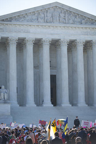 Supporters of traditional marriage and same-sex marriage gather in front of the U.S. Supreme Court in Washington April 28. The high court began hearing arguments in cases involving four states that bar same-sex marriage. (CNS photo/Tyler Orsburn)