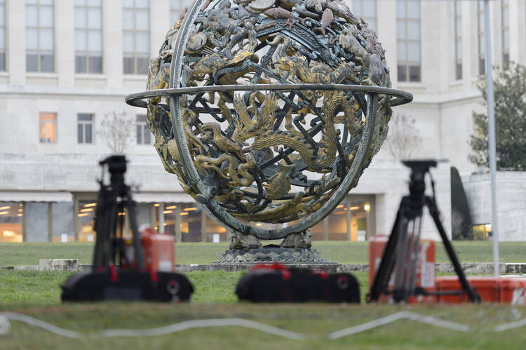 Camera tripods sit in front the United Nations building before the planned beginning of negotiations between the Syrian government and the opposition in Geneva, Switzerland, Friday, Jan. 29, 2016. (Martial Trezzini/Keystone via AP)