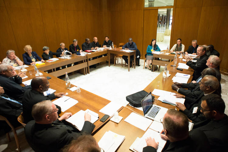 English-speaking delegates at the Synod of Bishops on the family meet to discuss the working document at the Vatican, Oct. 19 (CNS photo/L'Osservatore Romano). 