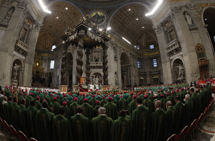 Pope Francis and members of the Synod of Bishops on the family concelebrate the opening Mass of the synod in St. Peter's Basilica, Oct. 4 (CNS/Paul Haring).