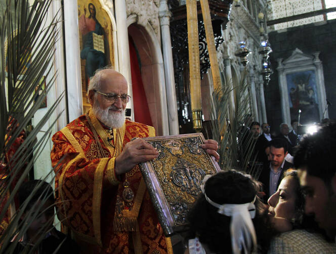 Melkite Catholic Patriarch Gregoire III Laham presides at Palm Sunday service in Damascus in this April 1, 2012, file photo. (Catholic News Service photo/Reuters)