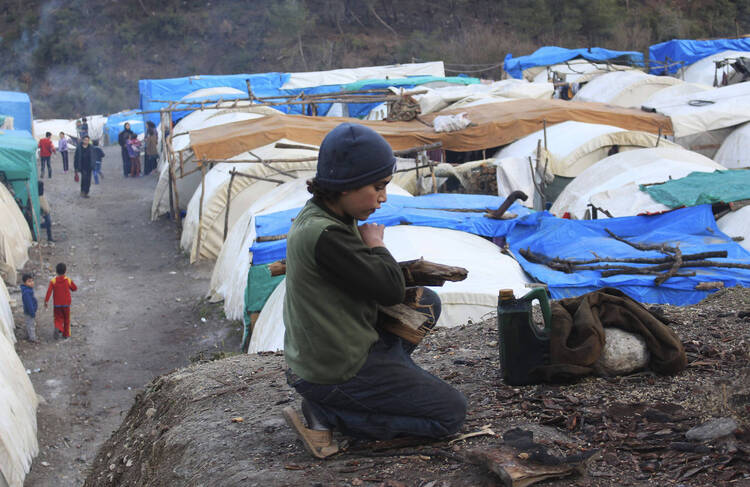 A Syrian refugee near the Turkish border