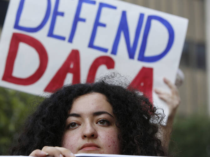 Loyola Marymount University student and "Dreamer" Maria Carolina Gomez joins a rally in support of the Deferred Action for Childhood Arrivals, or DACA, program outside the Edward Roybal Federal Building in Los Angeles on Sept. 1, 2017. (AP Photo/Damian Dovarganes) (Caption amended by RNS)