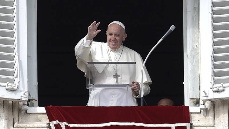 Pope Francis waves during the Angelus noon prayer he delivers from his studio window overlooking St. Peter's Square at the Vatican on Nov. 3, 2019. (AP Photo/Gregorio Borgia via RNS)