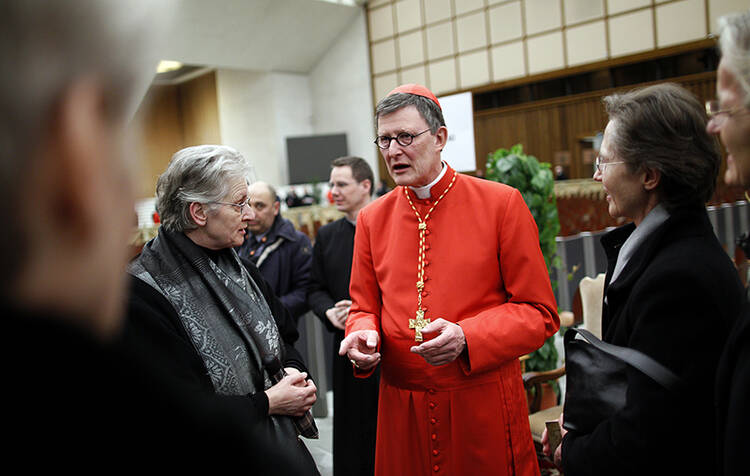 Cardinal Rainer Maria Woelki of Germany receives guests in the Paul VI Hall at the Vatican on Feb. 18, 2012. Photo courtesy of REUTERS/Tony Gentile