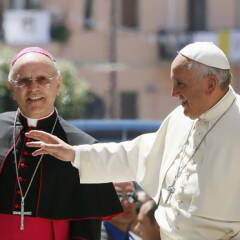 Pope Francis greets people as he visits Cassano allo Ionio, in Italy’s Calabria region, June 21, 2014. On his left is Bishop Nunzio Galantino of Cassano allo Ionio. (CNS Photo/Paul Haring)