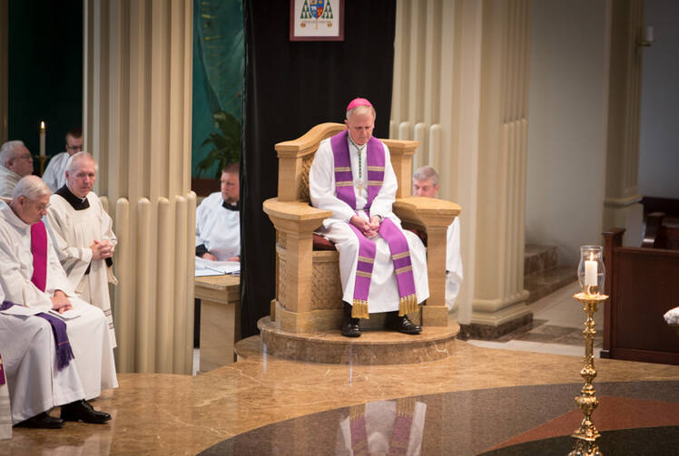 Bishop James V. Johnston Jr. of the Kansas City-St. Joseph Diocese, prays during the “Service of Lament” at the Cathedral of the Immaculate Conception in downtown Kansas City, Mo., on June 26, 2016. RNS photo by Sally Morrow