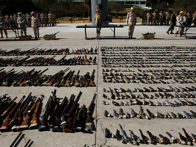 Weapons seized from criminal gangs are displayed before being destroyed by military personnel at a military base in Tijuana, Mexico, on August 12, 2016. Photo courtesy of REUTERS/Jorge Duenes